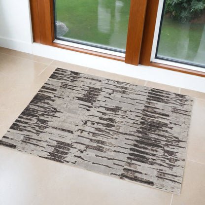 2' X 3' Gray and Ivory Abstract Power Loom Area Rug