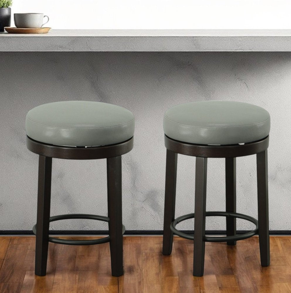 Set of Two 24" Gray and Espresso Faux Leather and Solid Wood Backless Counter Height Swivel Bar Chairs HomeRoots