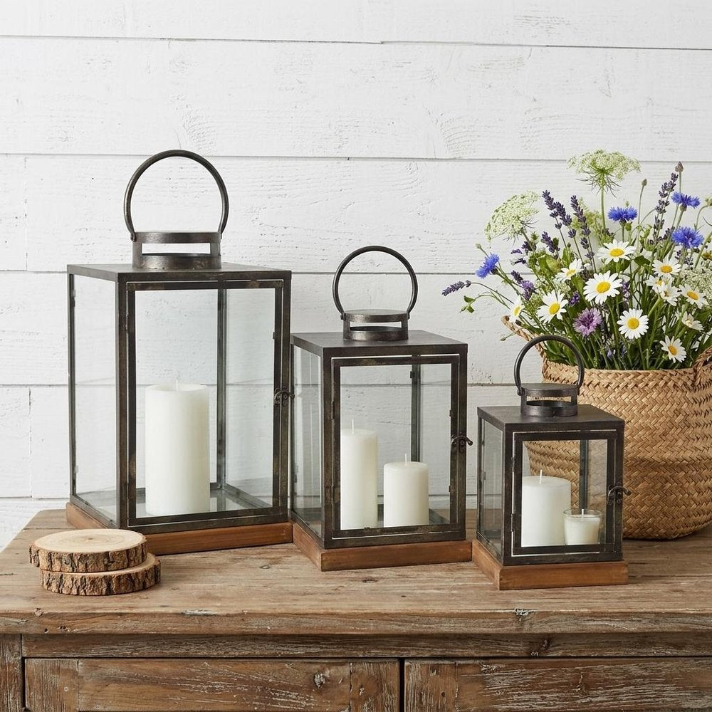 Set of Three Gray And Brown Distressed Geometric Glass Metal And Wood Floor Lantern Candle Holders HomeRoots