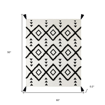 60" X 50" Black and White Woven Cotton Geometric Throw Blanket with Tassels HomeRoots