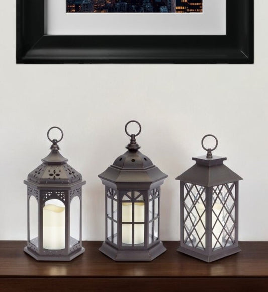 Set of Three Dark Brown Distressed Ornate Glass And Plastic Floor Lantern Candle Holders With Candle HomeRoots