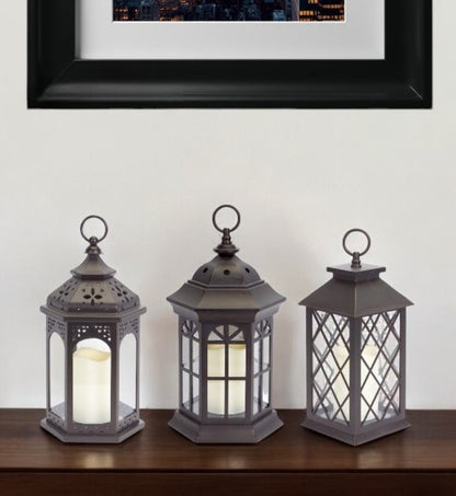 Set of Three Dark Brown Distressed Ornate Glass And Plastic Floor Lantern Candle Holders With Candle HomeRoots