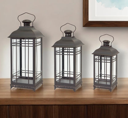 Set of Three Black Distressed Geometric Glass And Metal Floor Lantern Candle Holders HomeRoots