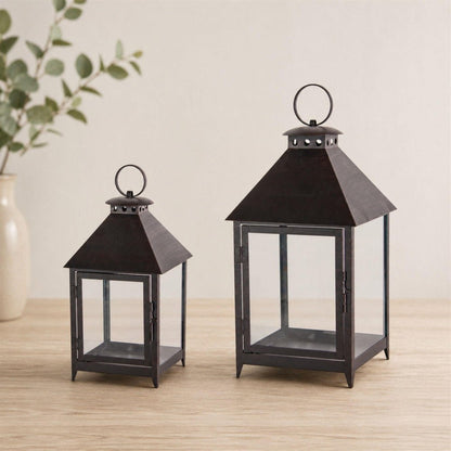 Set of Two Black Geometric Iron And Glass Floor Lantern Candle Holders HomeRoots