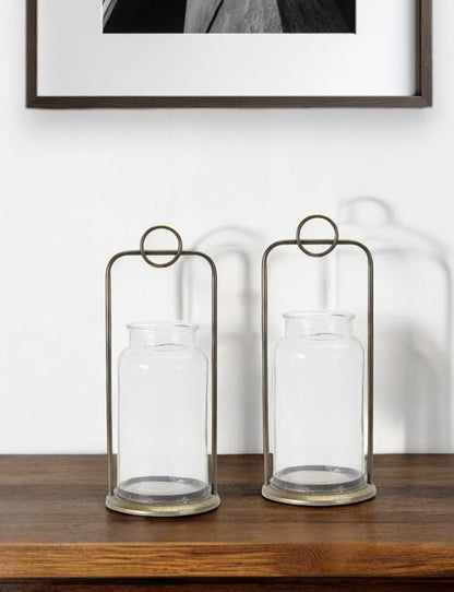 Set of Two Bronze Metal And Glass Tabletop Hurricane Candle Holders HomeRoots