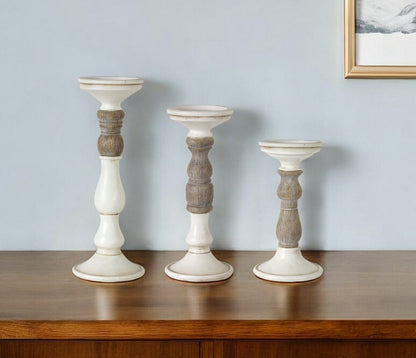 Set of Three Ivory and Natural Resin Tabletop Pillar Candle Holders HomeRoots