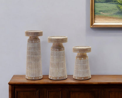 Set of Three Natural And White Distressed Geometric Polyresin Tabletop Pillar Candle Holders HomeRoots