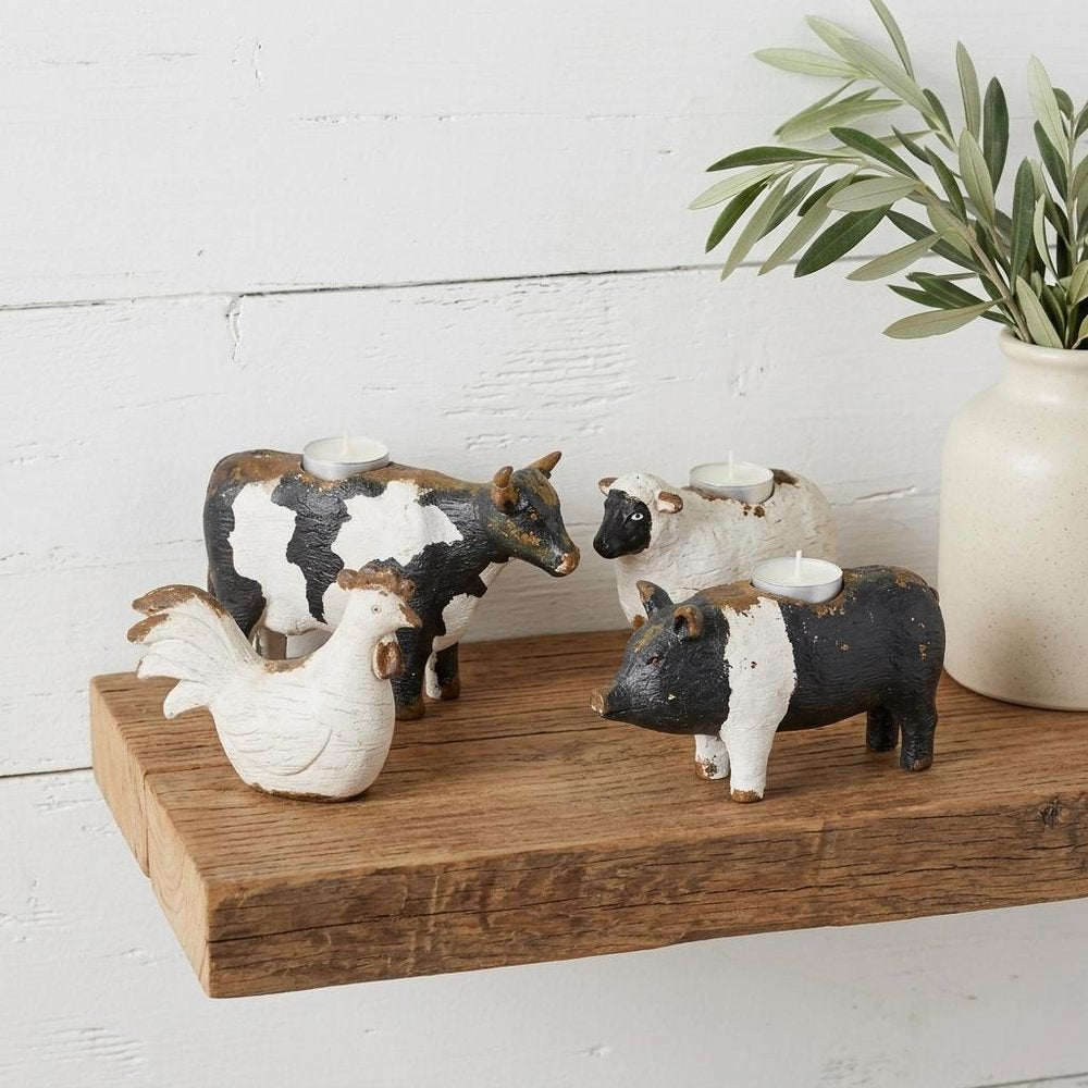 Set of Four Black and White Farm Animal Polyresin Tabletop Candleholders HomeRoots