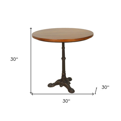 30" Chestnut And Black Rounded Solid Wood And Iron Pedestal Base Dining Table HomeRoots