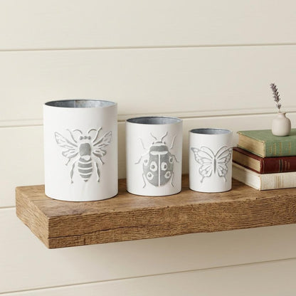 Set of Three White And Gray Metal 9 Ounce Abstract Round Distressed Pot Planters HomeRoots