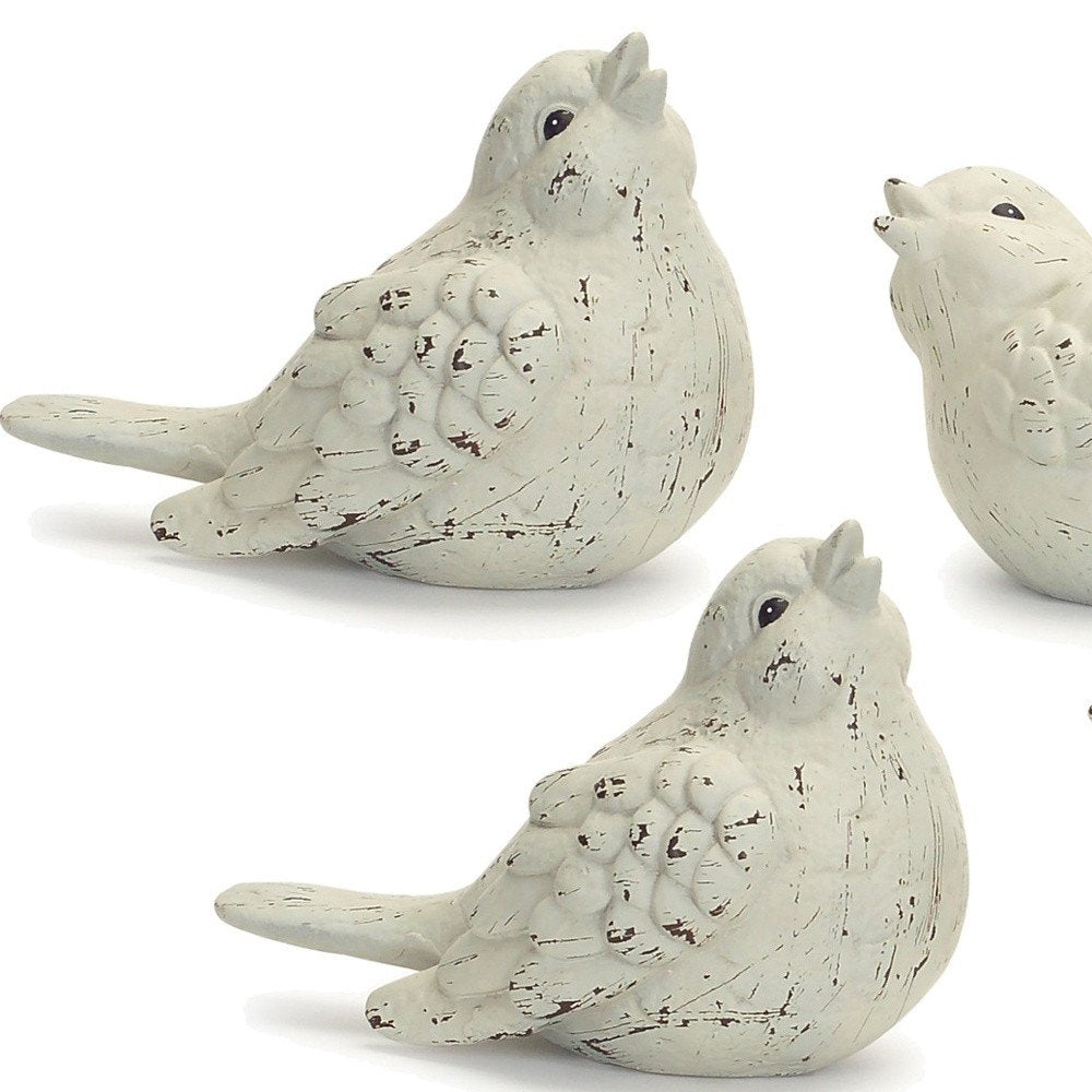 Set of Four Ivory Ceramic Bird Figurines HomeRoots