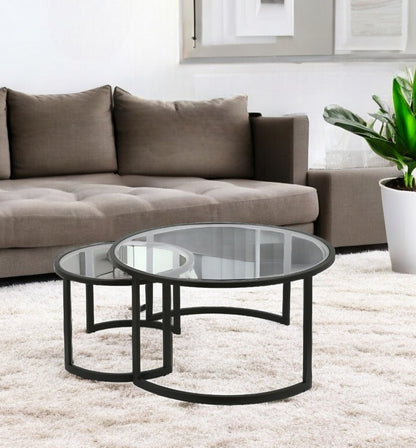 Set of Two 36" Black Glass And Steel Round Nested Coffee Tables