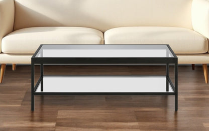 45" Clear And Black Glass And Steel Coffee Table With Shelf