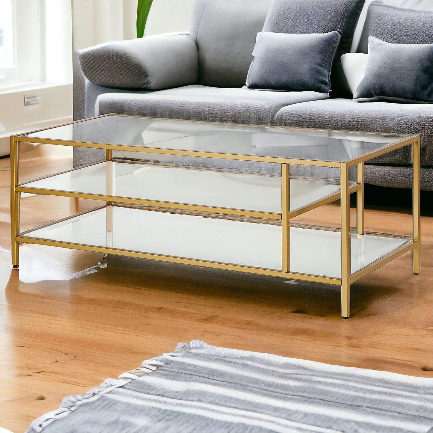 46" Gold Glass And Steel Coffee Table With Two Shelves - FurniFindUSA