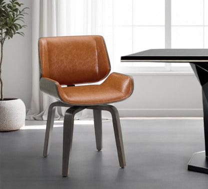 Black and Brown Upholstered Faux Leather Curved Back Dining Side Chair HomeRoots