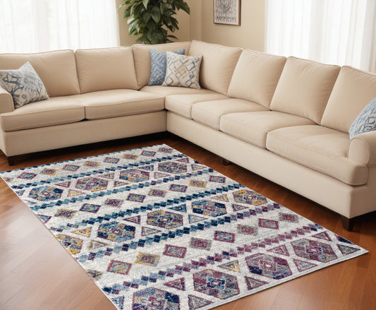 9' X 12' Ivory Blue and Orange Geometric Power Loom Area Rug - 105.0" (H) x 141.0" (W) x 0.38" (D)