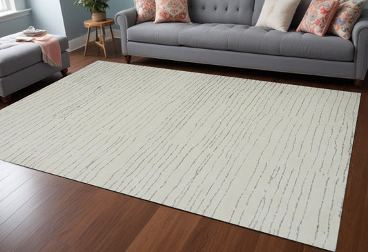 7' X 10' Beige and Gray Abstract Power Loom Distressed Area Rug - 78.0" (H) x 114.0" (W) x 0.4" (D)