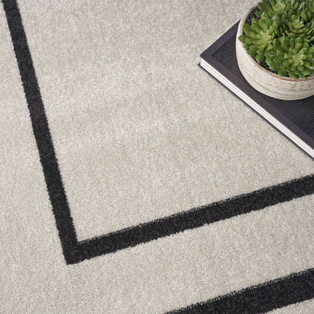 9' X 12' Ivory And Black Indoor Outdoor Area Rug