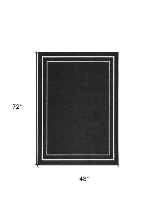4' X 6' Black And Ivory Indoor Outdoor Area Rug