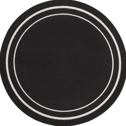 8' Black And Ivory Round Indoor Outdoor Area Rug