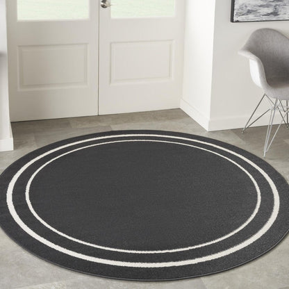 8' Black And Ivory Round Indoor Outdoor Area Rug HomeRoots