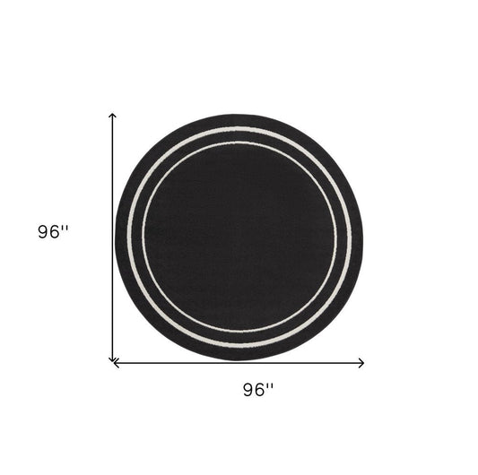 8' Black And Ivory Round Indoor Outdoor Area Rug