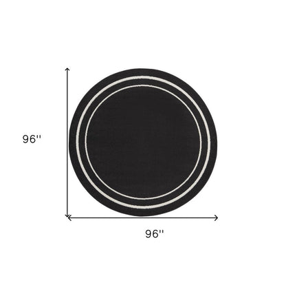 8' Black And Ivory Round Indoor Outdoor Area Rug