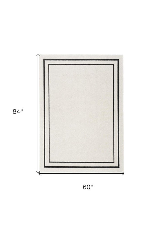 5' X 7' Ivory And Black Indoor Outdoor Area Rug