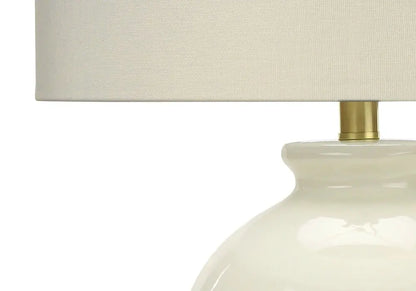 26" Gold and Ivory Ceramic Urn Table Lamp With Cream Drum Shade HomeRoots