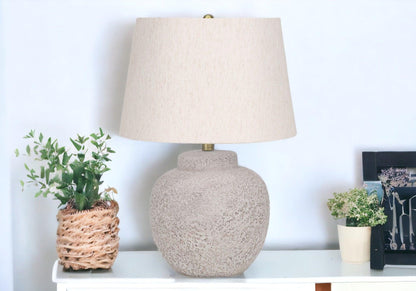 22" Cream Concrete Urn Table Lamp With Cream Abstract Empire Shade - FurniFindUSA