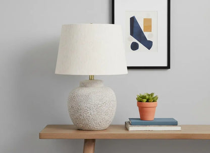 22" Cream Concrete Urn Table Lamp With Cream Abstract Empire Shade HomeRoots