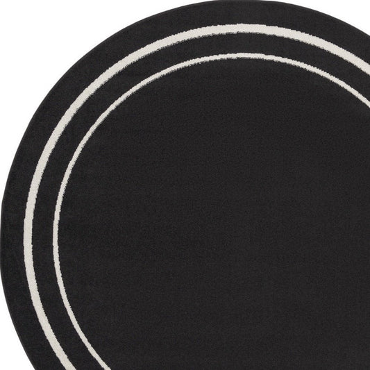 6' Black And Ivory Round Indoor Outdoor Area Rug