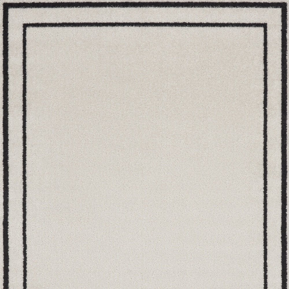 2' X 4' Ivory And Black Indoor Outdoor Area Rug HomeRoots