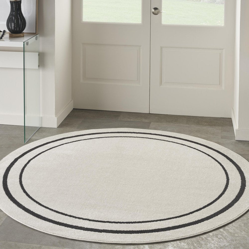 6' Ivory And Black Round Indoor Outdoor Area Rug
