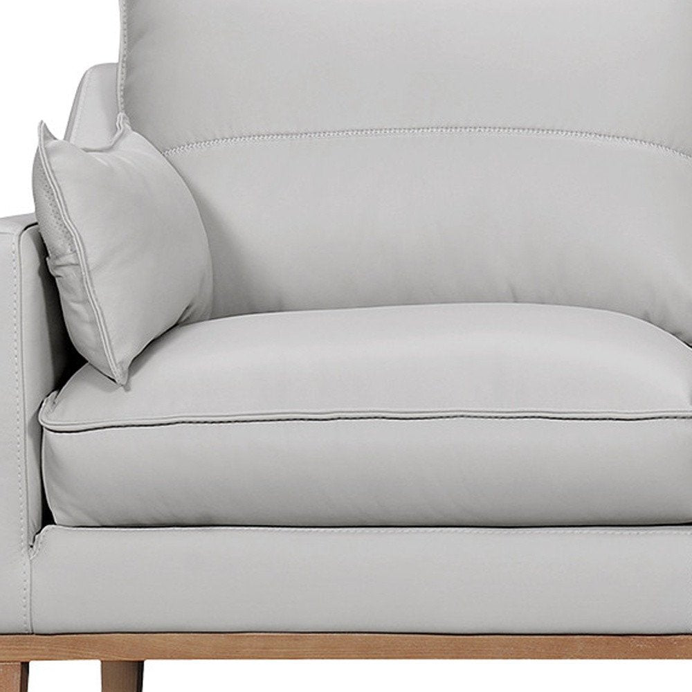 87" Gray Leather Sofa And Toss Pillows With Brown Legs HomeRoots
