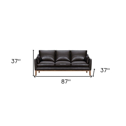 87" Dark Brown Leather Sofa And Toss Pillows With Brown Legs HomeRoots
