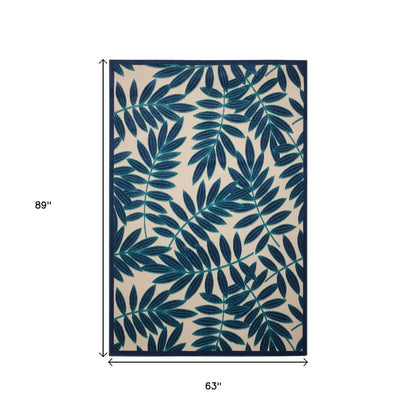 5' X 8' Navy Blue And Ivory Palm Leaf Indoor Outdoor Area Rug
