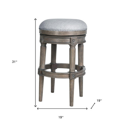 31" Gray Fabric And Solid Wood Backless Bar Height Swivel Bar Chair HomeRoots