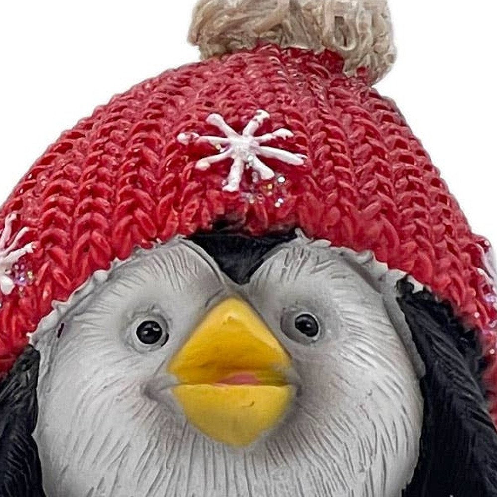 Set of Three Black White And Red Resin Penguin Christmas Reindeer Figurine HomeRoots