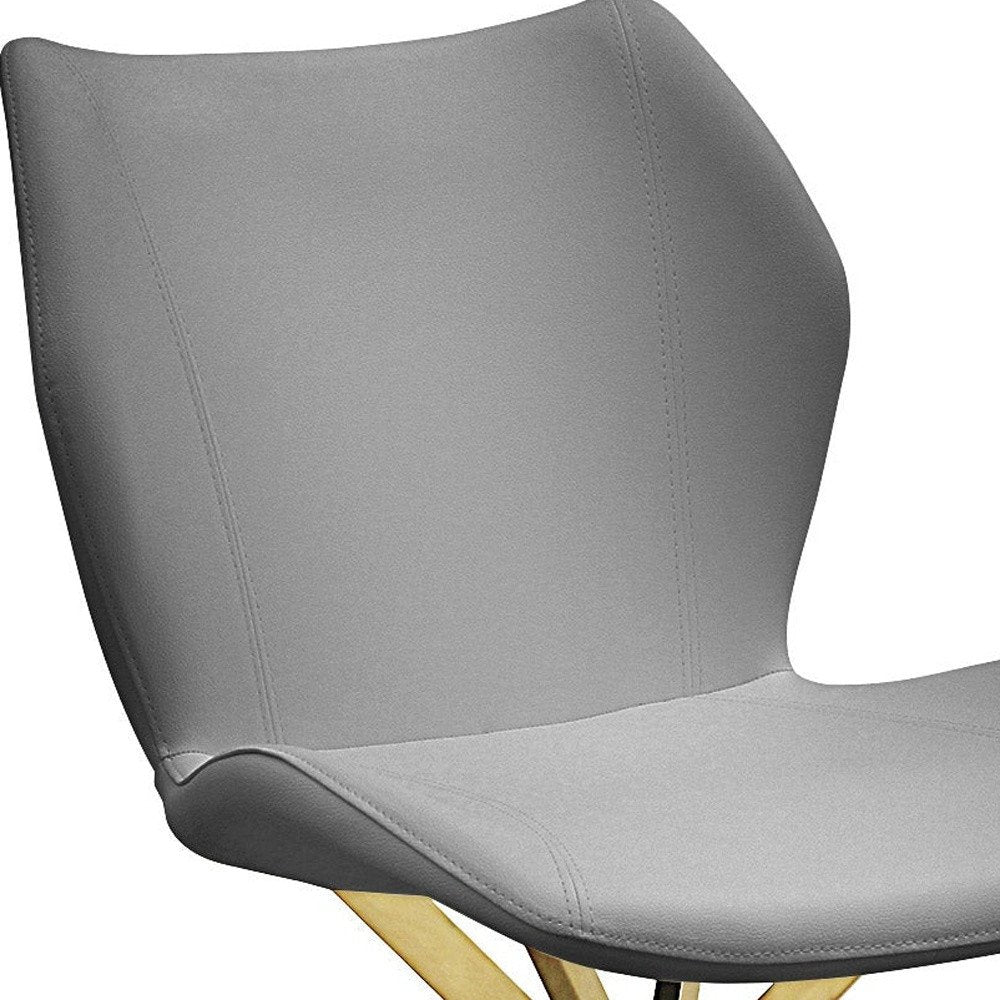 Set of Four Gray And Gold Faux Leather And Metal Dining Side Chairs HomeRoots