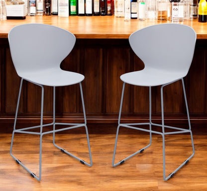 Set of Two 26" Gray Heavy Duty Plastic and Metal Low Back Counter Height Bar Chairs HomeRoots