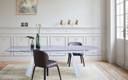 63" White Ceramic and Metal Self-Storing Leaf Pedestal Base Extendable Dining Table HomeRoots