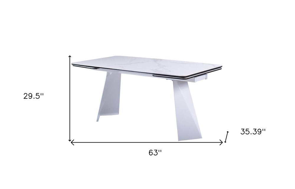 63" White Ceramic and Metal Self-Storing Leaf Pedestal Base Extendable Dining Table HomeRoots