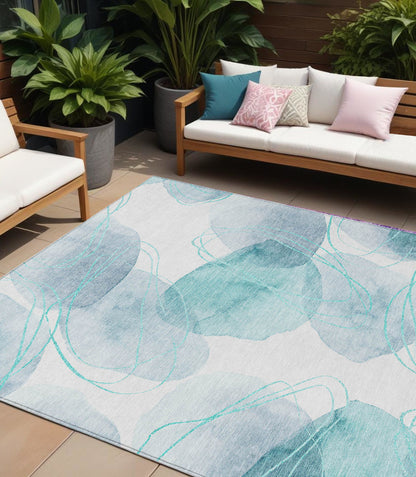 8' X 10' Teal and Ivory Abstract Washable Non Skid Indoor Outdoor Area Rug