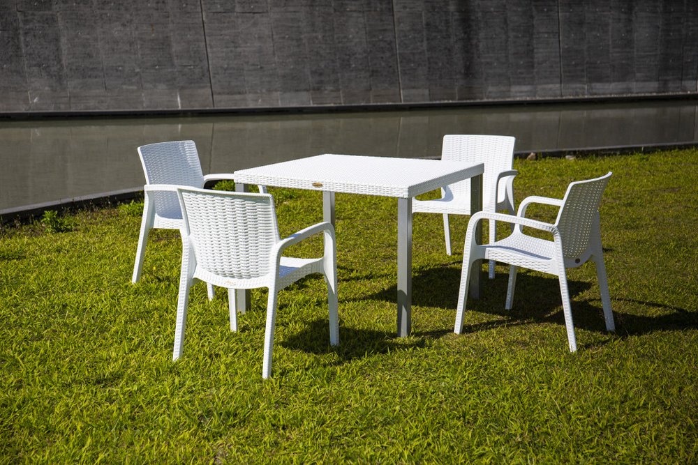 Set of Two White Faux Rattan Heavy Duty Plastic Outdoor Stacking Arm Chairs HomeRoots