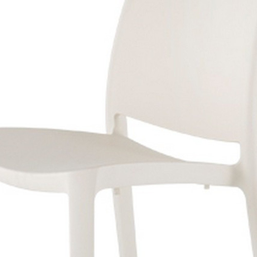 Set of Four White Heavy Duty Plastic Outdoor Stacking Dining Chairs HomeRoots