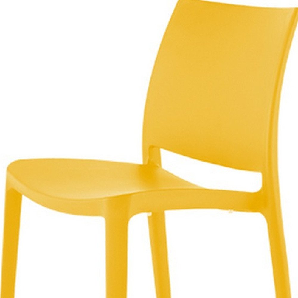 Set of Four Gold Heavy Duty Plastic Outdoor Stacking Dining Chairs HomeRoots