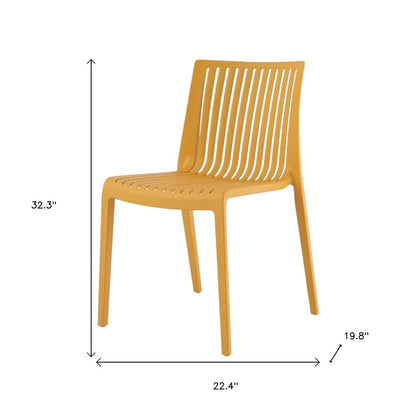 Set of Two Gold Heavy Duty Plastic Outdoor Stacking Accent Chairs HomeRoots