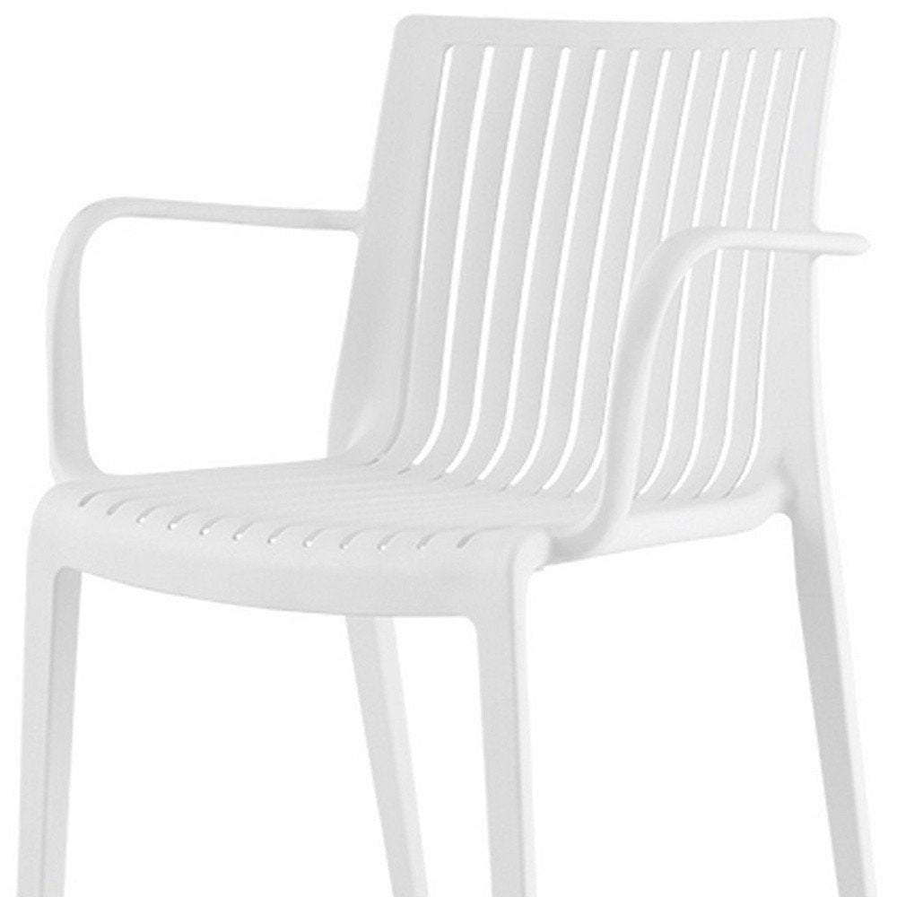 Set of Two White Heavy Duty Plastic Outdoor Stacking Arm Chairs HomeRoots