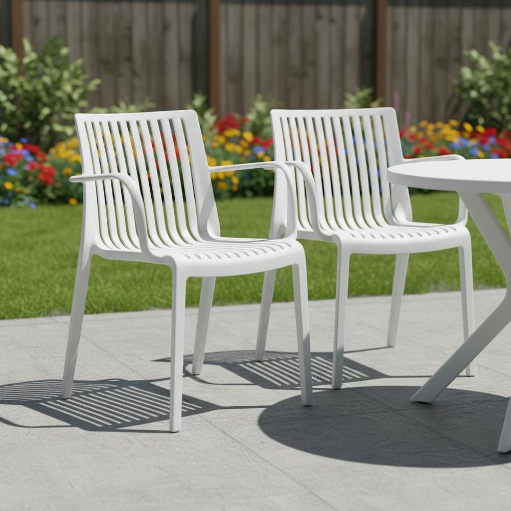 Set of Two White Heavy Duty Plastic Outdoor Stacking Arm Chairs HomeRoots